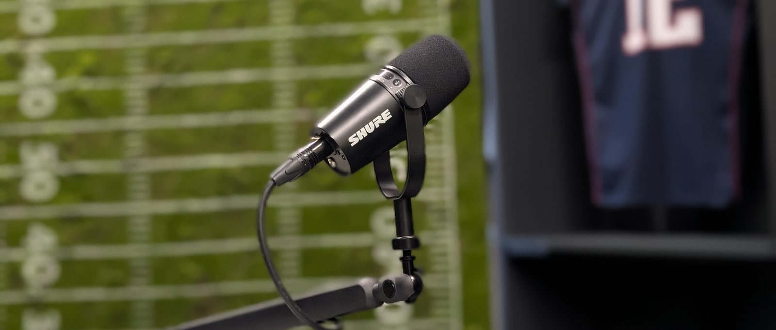 A microphone on the presenters' desk of the OKVideo.Pro sports set